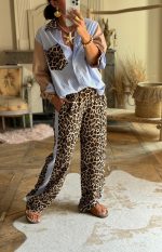 CASUAL TROUSERS IN ANIMAL PRINT AND STRIPE DETAIL